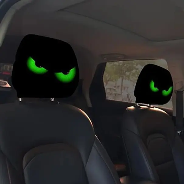 Ofertă exclusivă 2 buc. Capac pentru suportul de cap auto 28 x 26 cm Capac negru din poliester cu motiv de ochi verzi Decorare interior auto