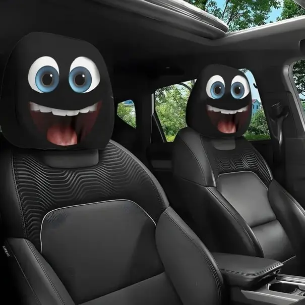 Retur ușor 2 buc. Capac pentru suportul de cap auto 28 x 26 cm Capac din poliester negru cu motiv de ochi cu gura deschisa Decoratiune interioara