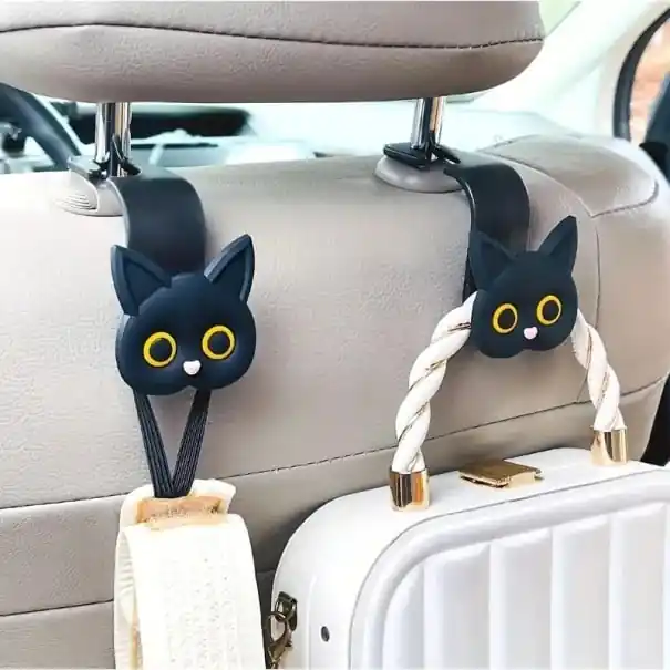 Discount Set de două suporturi auto în formă de cap de pisică pentru tetiere, ca și cum pisica ar ține în dinți o geantă, ochelari sau haine din ABS